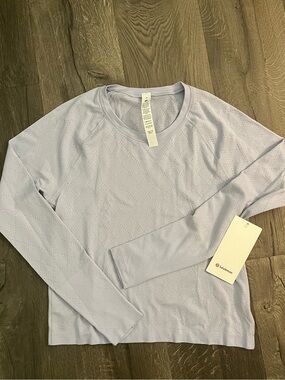 Swiftly Tech Long-Sleeve Shirt 2.0
Waist Length Sz 10 NWT ⭐️